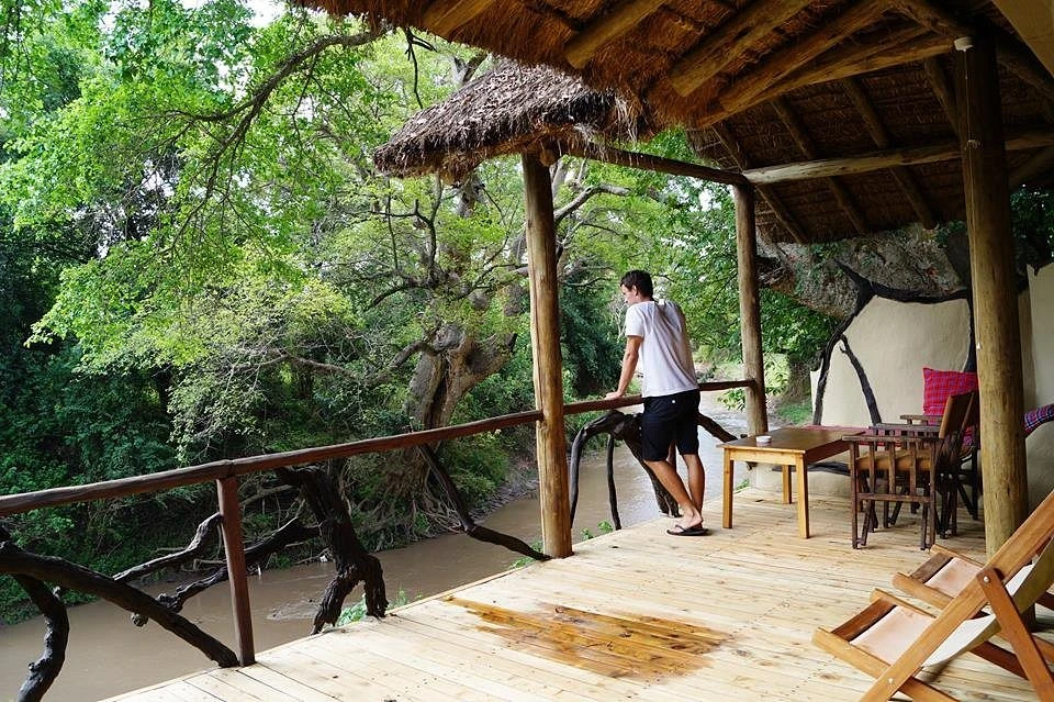 Basecamp Masai Mara Overview - Review, Photos, Rates & More 6 guest enjoying the view of river Talek at Basecamp masai mara